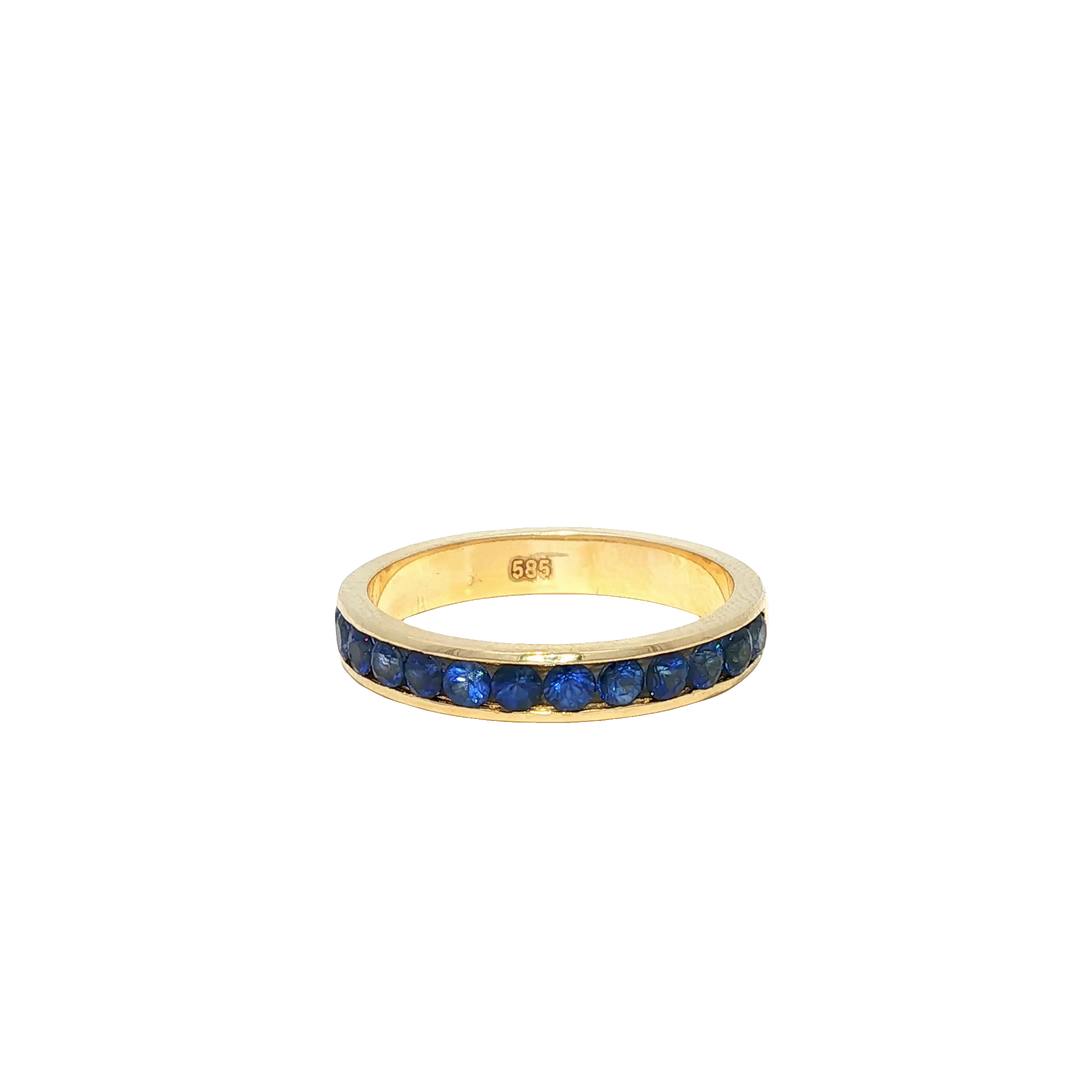 Yellow Gold Eternity Ring with Deep Blue Round Sapphire