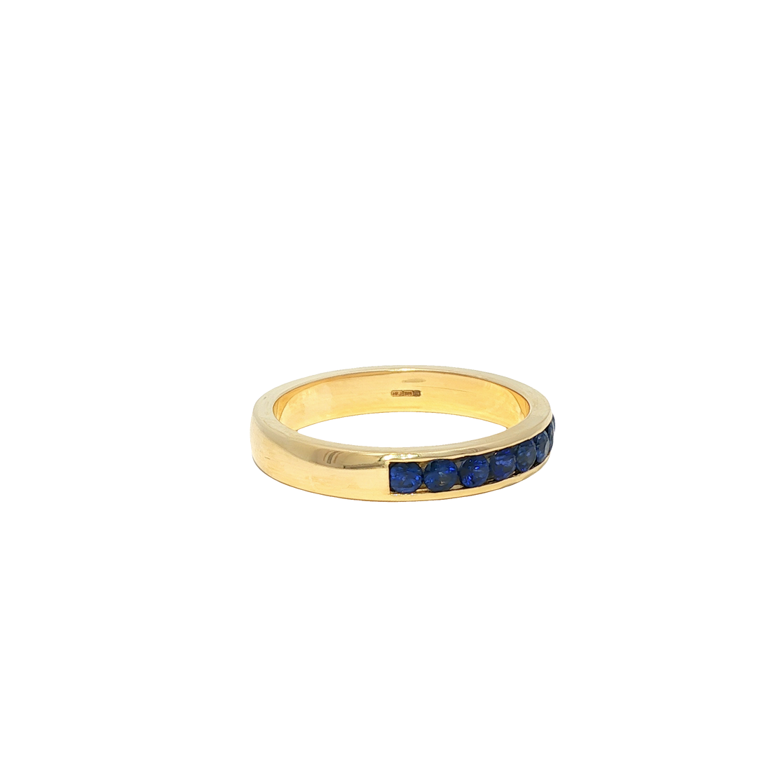 Yellow Gold Eternity Ring with Deep Blue Round Sapphire