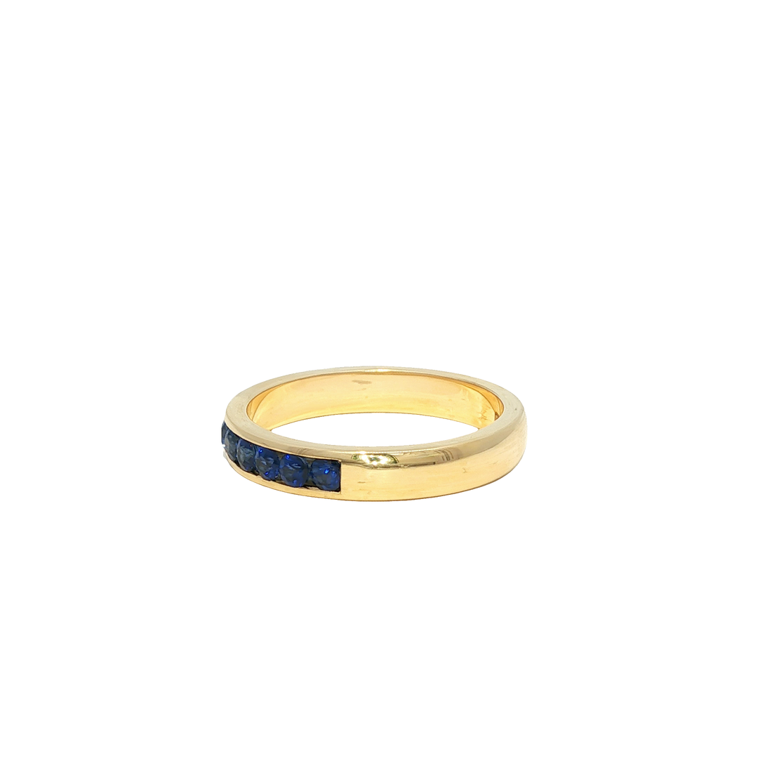 Yellow Gold Eternity Ring with Deep Blue Round Sapphire