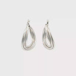 Load and play video in Gallery viewer, White Gold Twisted Hoop Earrings