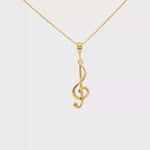Load and play video in Gallery viewer, Yellow Gold Treble Clef Charm Necklace