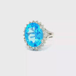 Load and play video in Gallery viewer, White Gold Ring with Brilliant Cut Blue Topaz and Diamon
