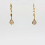 Load and play video in Gallery viewer, Yellow Gold Dangle Earrings with Round Brilliant Diamonds