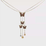 Load and play video in Gallery viewer, Butterfly Charm Necklace in Yellow Gold
