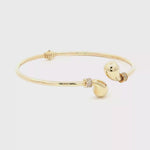 Load and play video in Gallery viewer, Elegant Yellow Gold Bangle Adorned with Round Brilliant Cut CZ