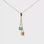 Load and play video in Gallery viewer, Yellow Gold Charm Necklace with Green Crystal Pendant