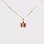 Load and play video in Gallery viewer, Yellow Gold Ladybug Charm Necklace with CZ Accent