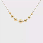 Load and play video in Gallery viewer, Yellow Gold Graduated Sphere Chain Necklace
