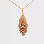 Load and play video in Gallery viewer, Yellow Gold Charm Necklace with Artistic Pendant Design