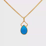 Load and play video in Gallery viewer, Yellow Gold Charm Necklace with Pear Cabochon Turquoise