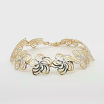 Load and play video in Gallery viewer, Floral Motif Yellow Gold Chain Bracelet