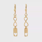 Load and play video in Gallery viewer, Yellow Gold Infinity Heart Dangle Earrings