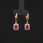 Load and play video in Gallery viewer, 18ct Yellow Gold Drop Earrings with Emerald Cut Ruby &amp; Diamond
