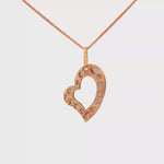 Load and play video in Gallery viewer, Rose Gold Heart Charm Necklace with Diamond Cut Accents