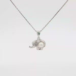 Load and play video in Gallery viewer, Gold Elephant Charm Necklace with Round Pearl Accent