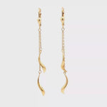 Load and play video in Gallery viewer, Elegant Yellow Gold Dangle Earrings with Stylized Motif