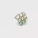 Load and play video in Gallery viewer, 19ct White Gold Ring with Oval Opal Cluster