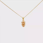 Load and play video in Gallery viewer, Elegant Yellow Gold Pinecone Charm Necklace