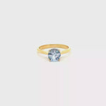 Load and play video in Gallery viewer, 18ct Gold Solitaire Ring with Round Light Blue Sapphire