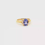 Load and play video in Gallery viewer, 18ct Gold Solitaire Ring with Purple Oval Tanzanite